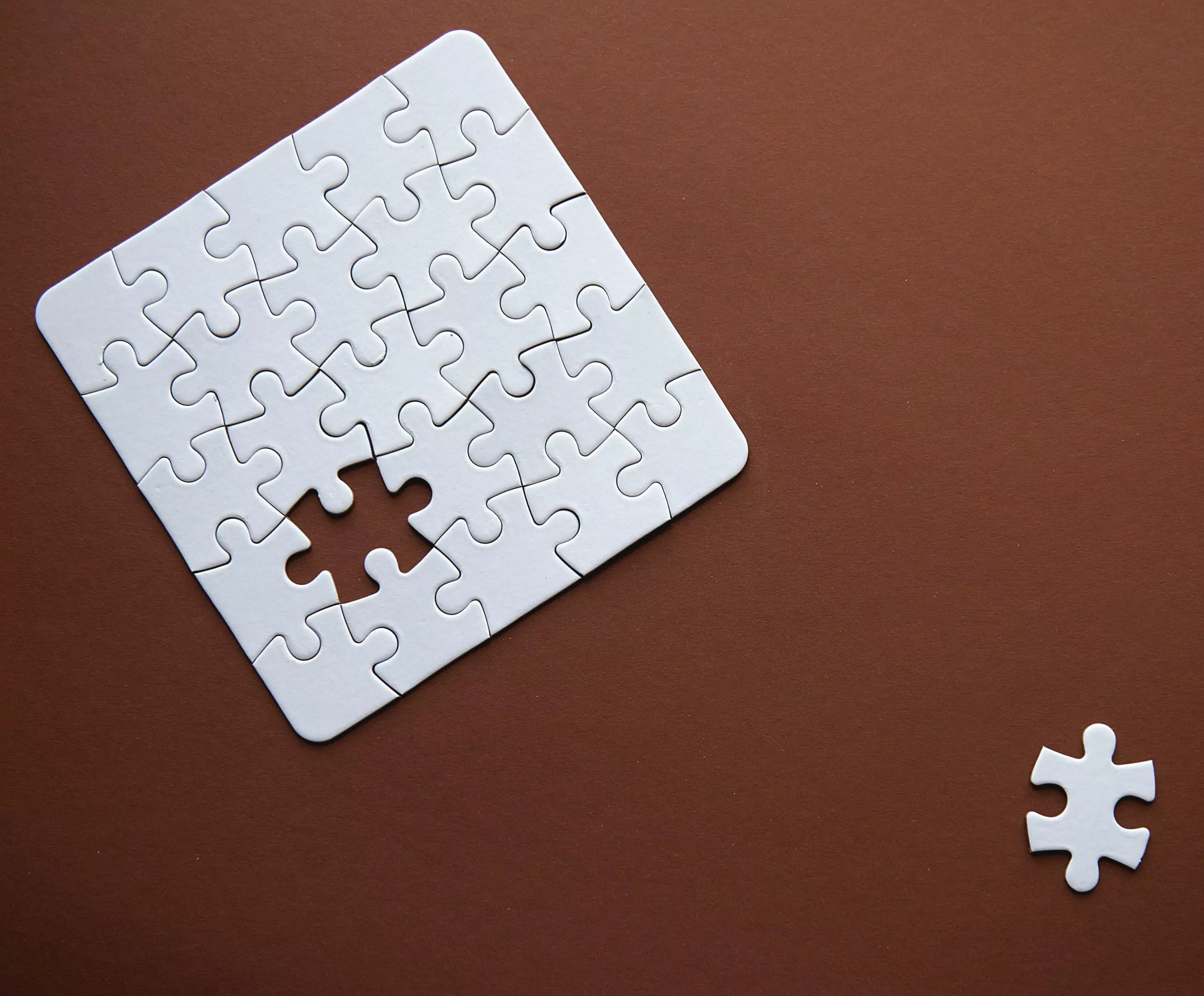 connected blank puzzle pieces isolated on a brown t20 vK6oKO scaled
